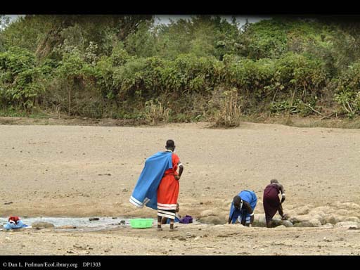 Doing washing in a stream, Tanzania